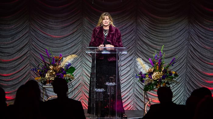 Mary Verdin speaking at a lectern at the San Luis Obispo Chamber annual dinner