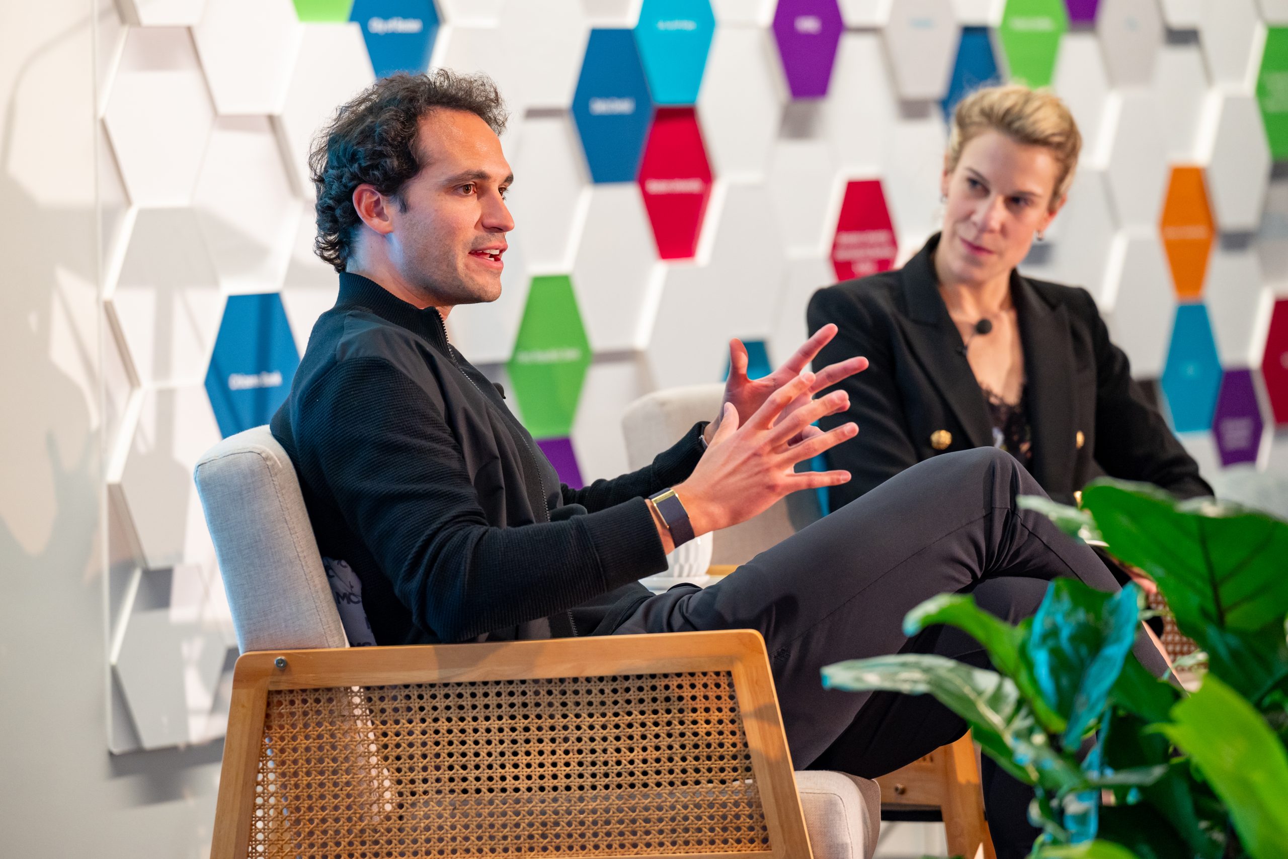 Two participants in conversation at a MassChallenge event