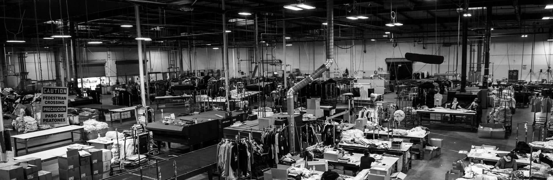 Wide black-and-white view of the Massive Prints production floor