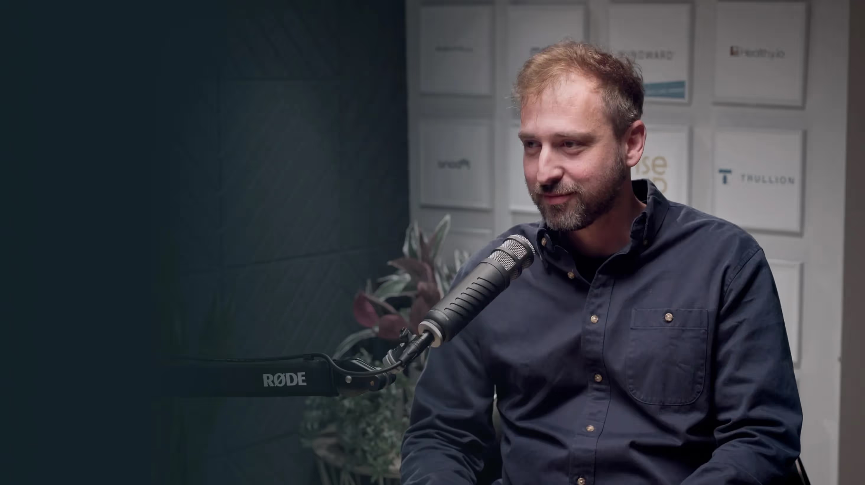 Matan Bar speaking into a microphone during his Invested interview
