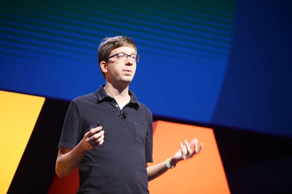 Matei Zaharia speaking onstage at a technology conference