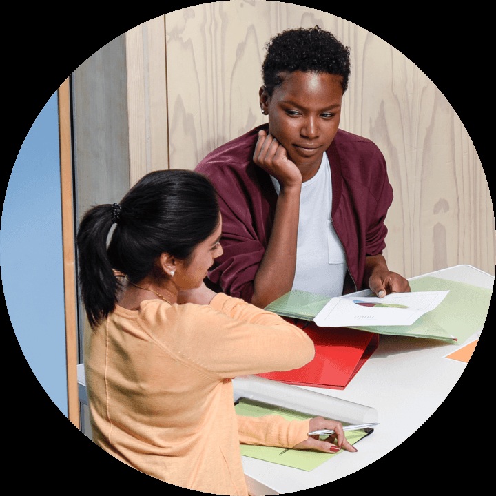 Two design professionals reviewing material selections at a table in Material Bank marketing photography