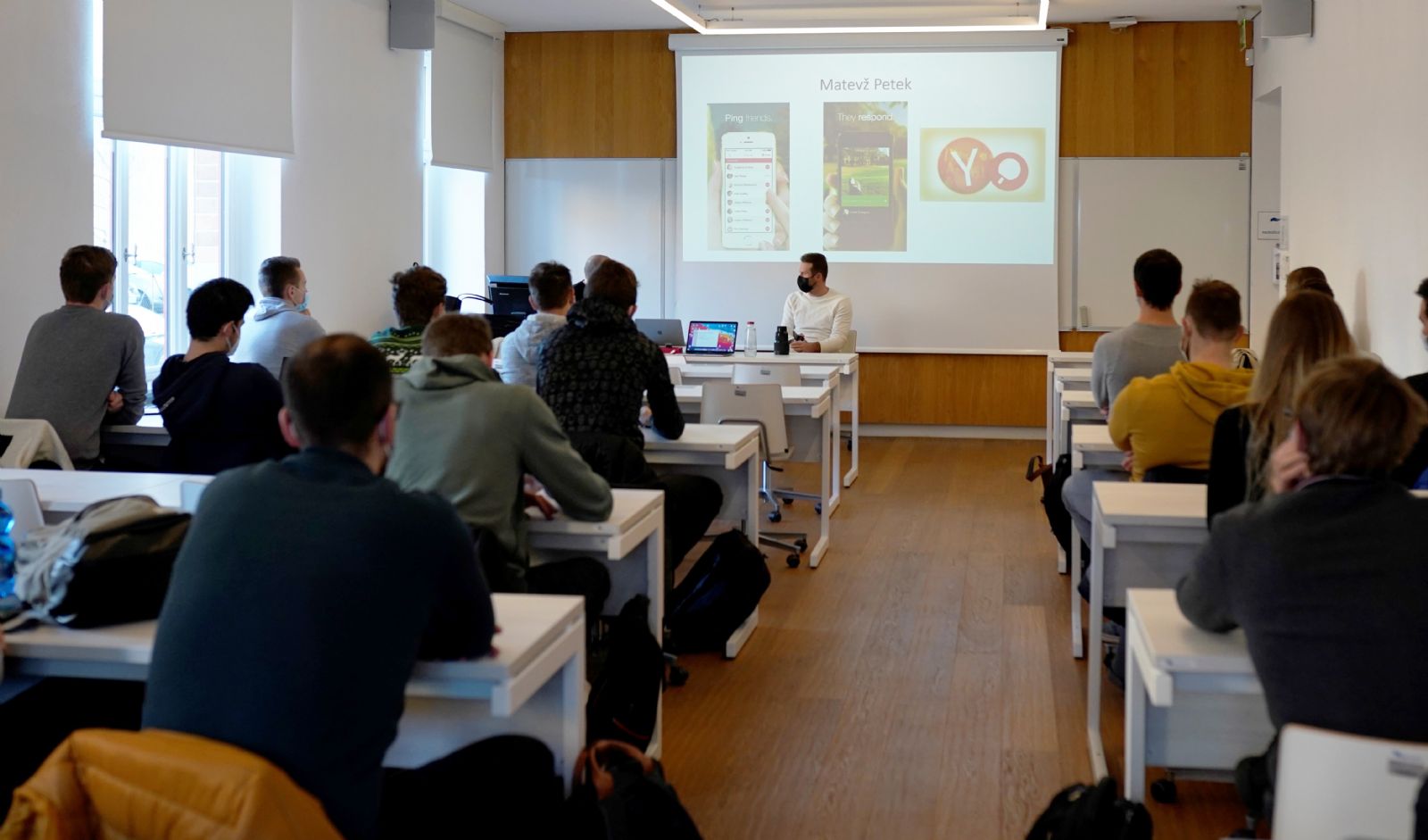 Matevž Petek discussing Povio with students in a classroom at the University of Maribor