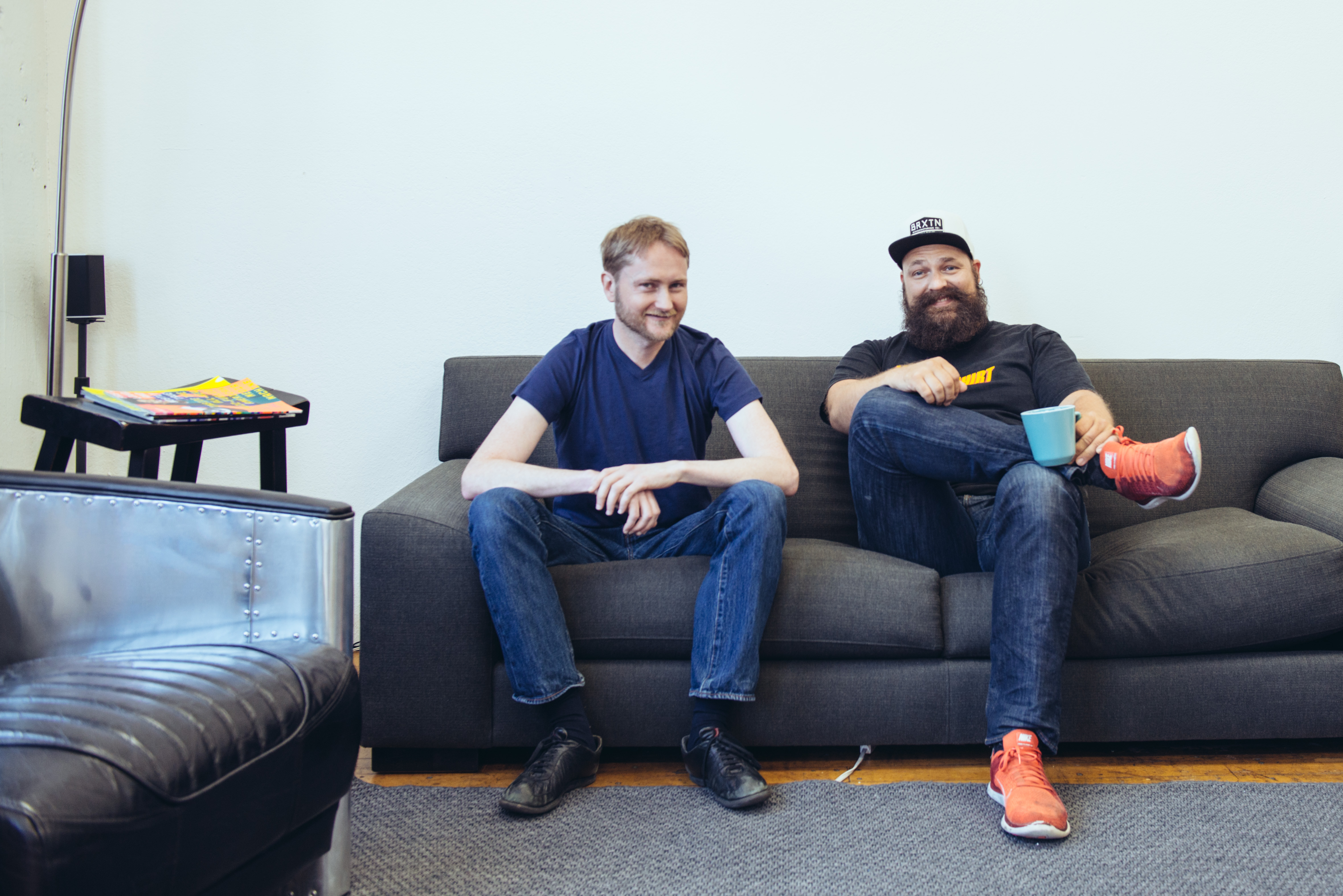 Mathias Biilmann and Christian Bach seated on a sofa in Netlify’s first office