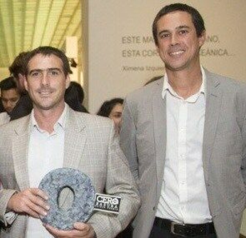 BioFiltro co-founders Rafael Concha and Matias Sjögren at an event, holding an award