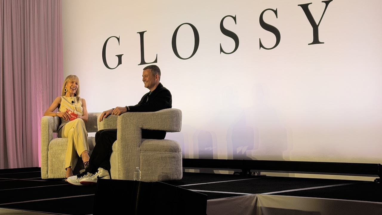 Matt Baer, seated at right in a black shirt, in conversation onstage at the Glossy E-Commerce Summit