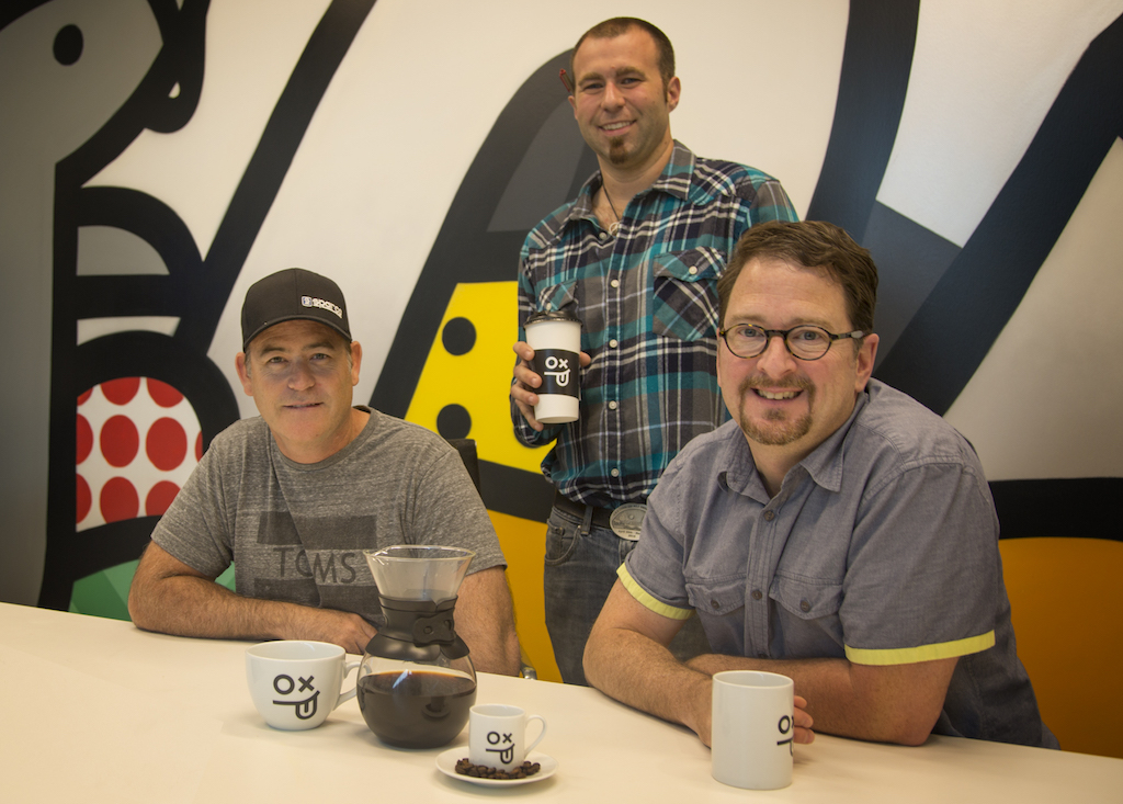 Ed Callahan seated left, Ryan Herzing standing center, and Matt Doud seated right at Order & Chaos