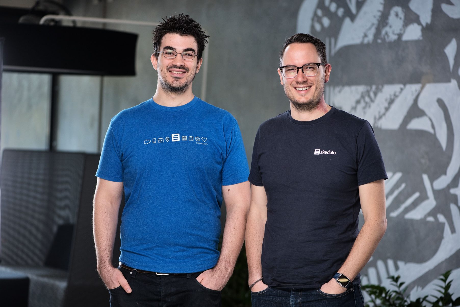 Skedulo co-founders James Davies, left, and Matt Fairhurst, right, standing together