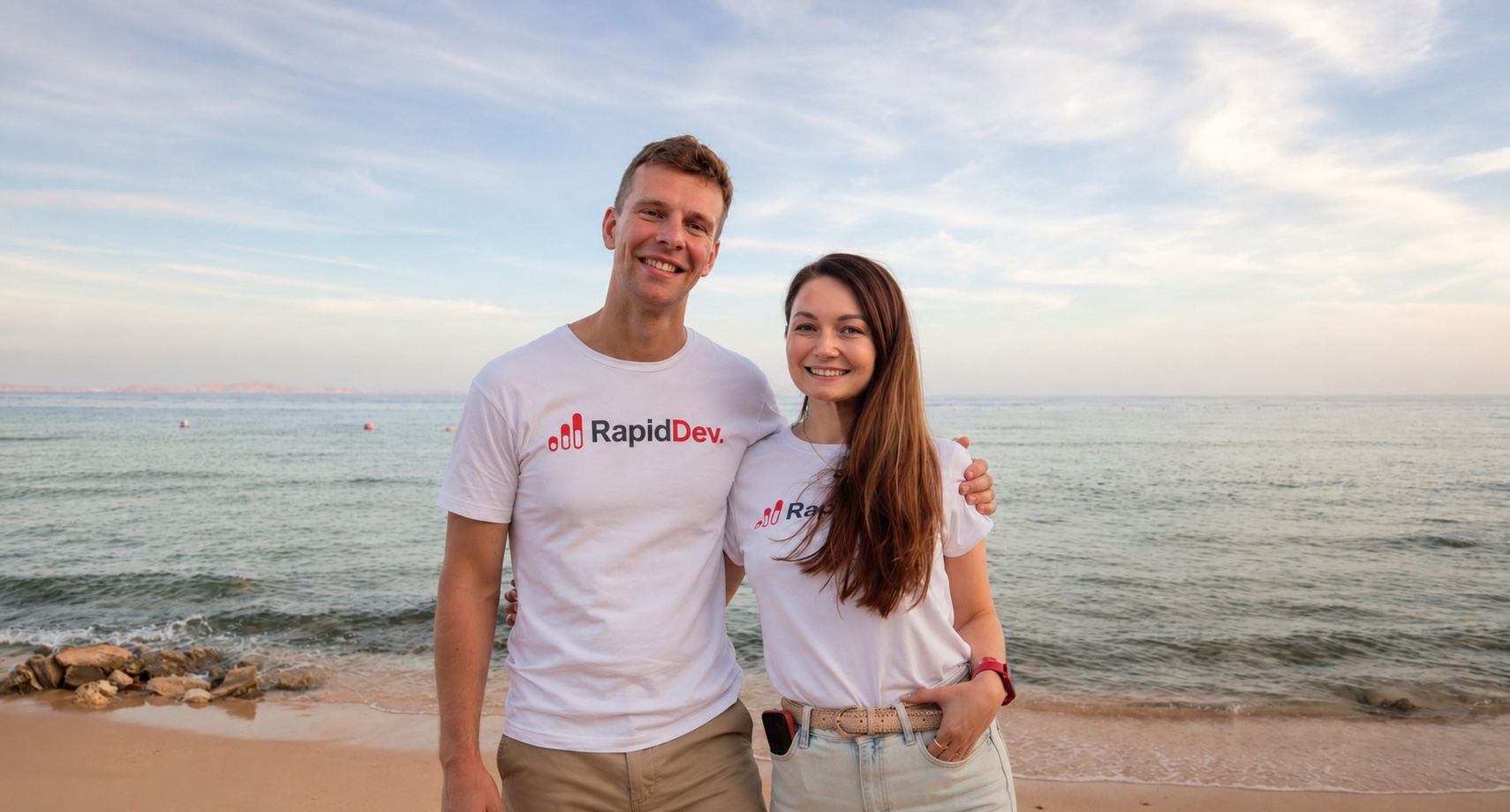 Matt Graham and RapidDev co-founder Anna Gafurova standing beside the sea