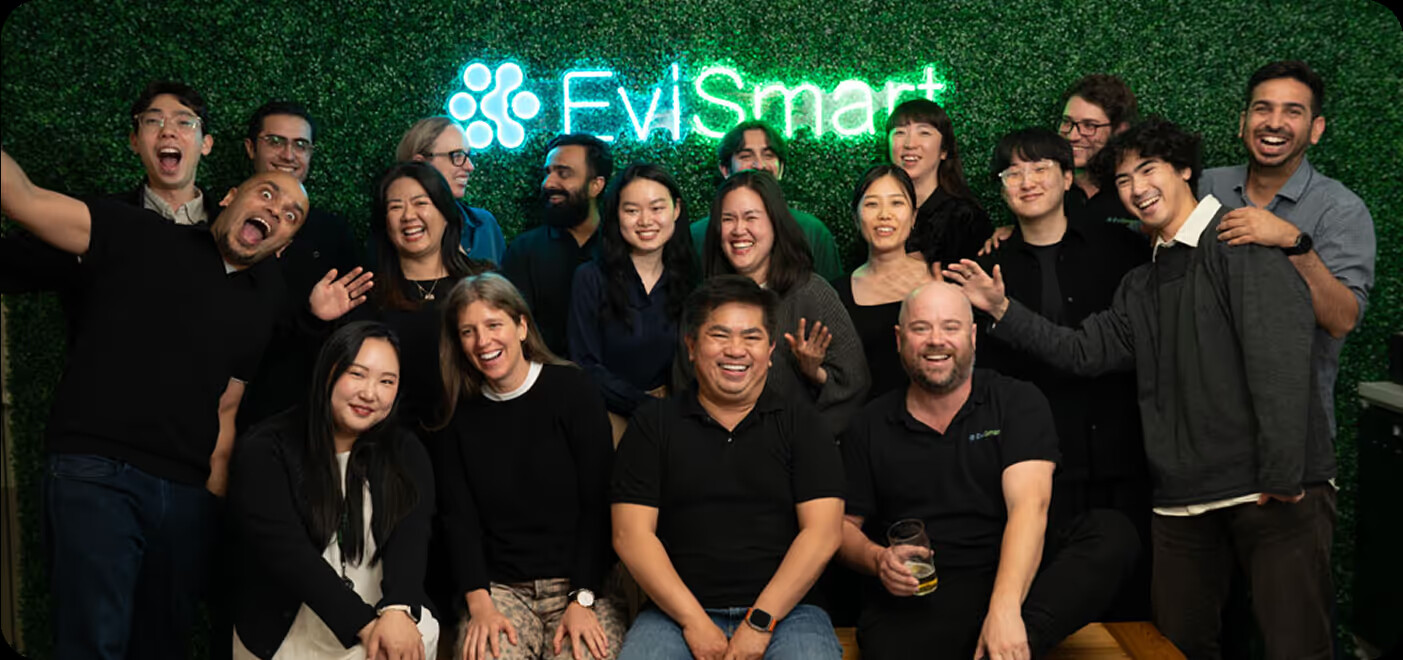 Members of the EviSmart team gathered together at work