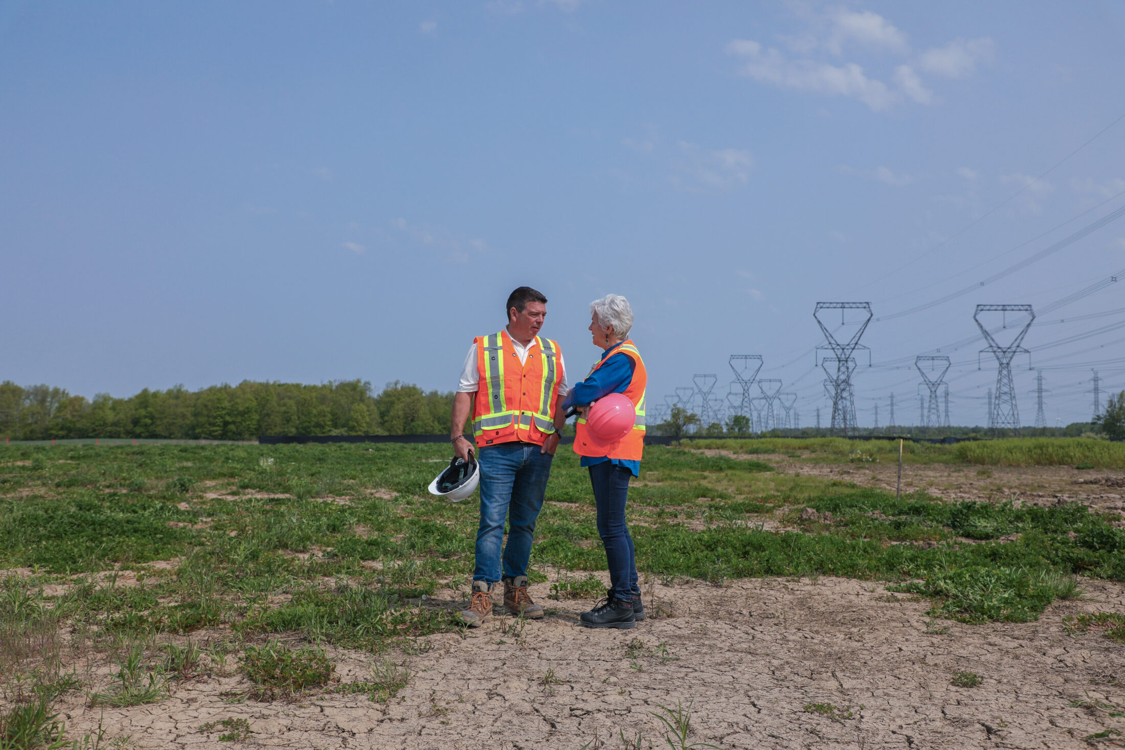 Matt Jamieson and Annette Verschuren in high-visibility vests at the Oneida Energy Storage site in Haldimand County