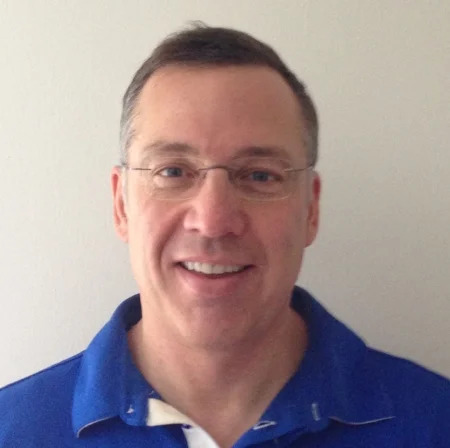 Matt Johnson in an early Q2B speaker portrait wearing a blue polo shirt