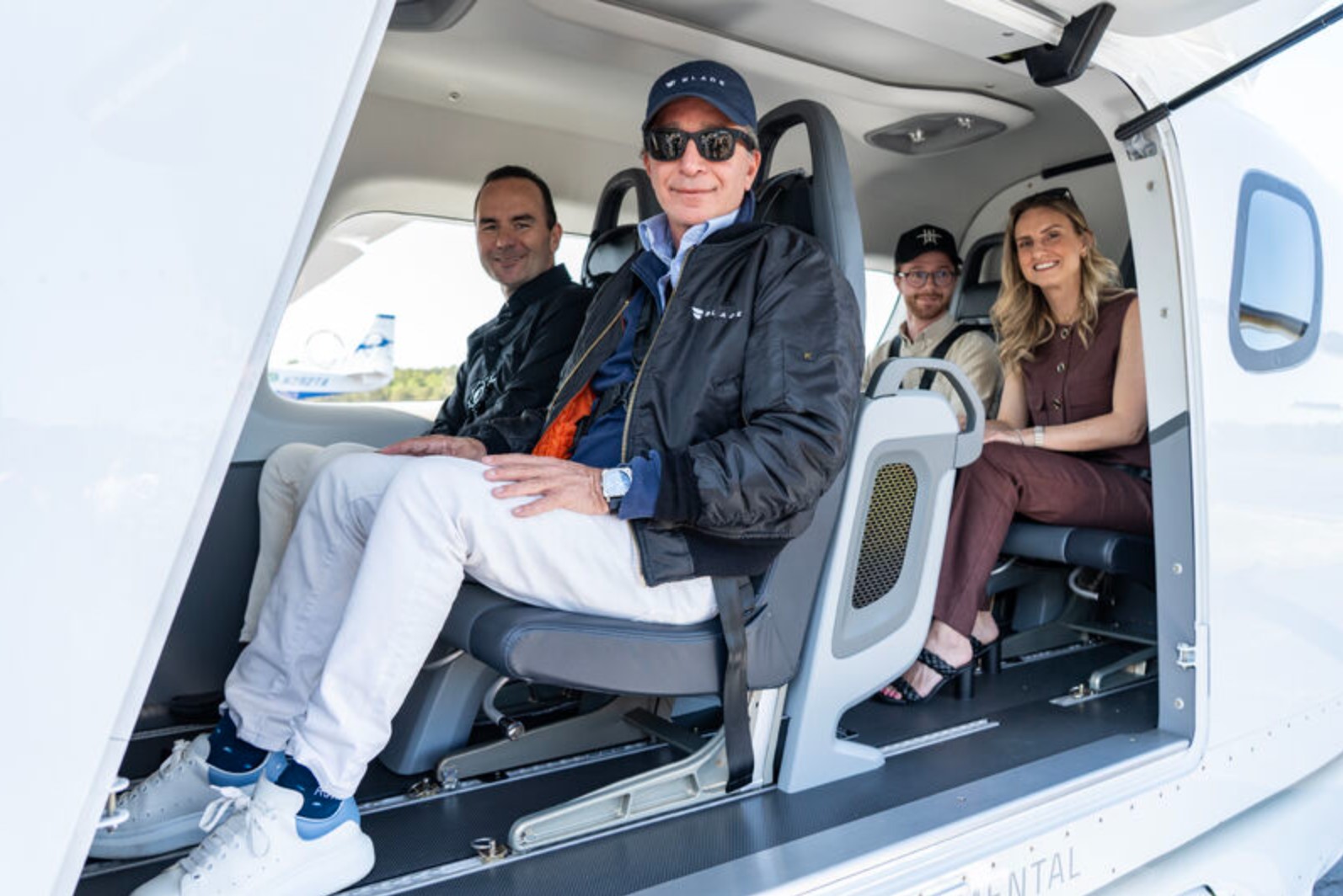 Matt Koscal, seated at left, with fellow passengers aboard BETA’s ALIA electric demonstration aircraft