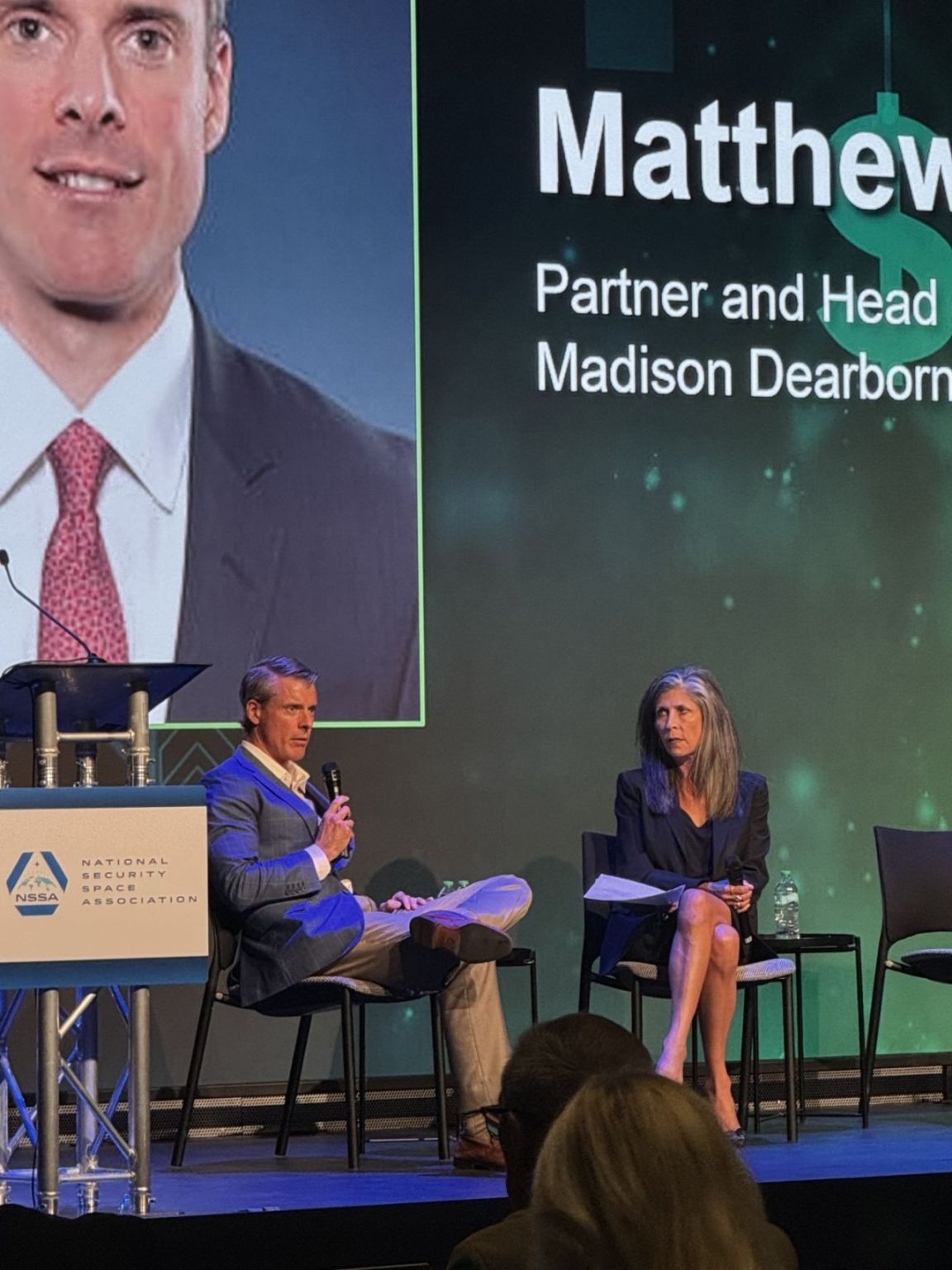 Matt Norton speaking with Jean Stack onstage at the 2025 NSSA Space Investors Forum
