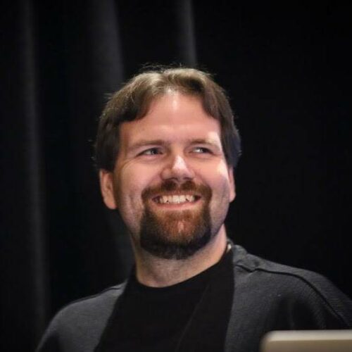 Matt Simmons smiling at a technology conference