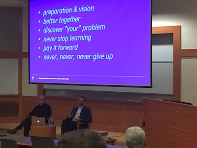 Joe Christopher, left, and Matt Tant, right, seated beneath a presentation at Vanderbilt