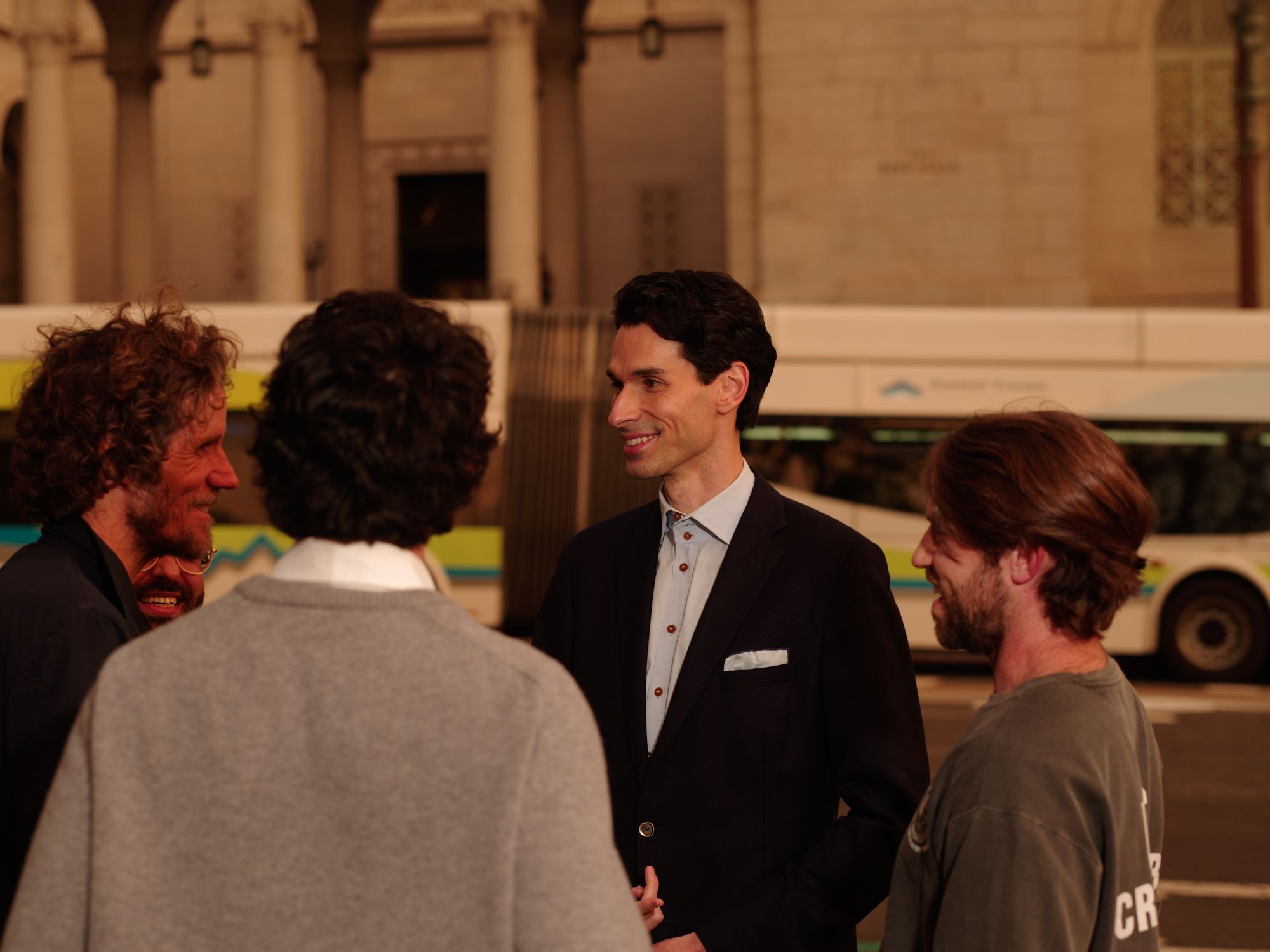 Matthew Chase Levy talking with a small group on a San Francisco street