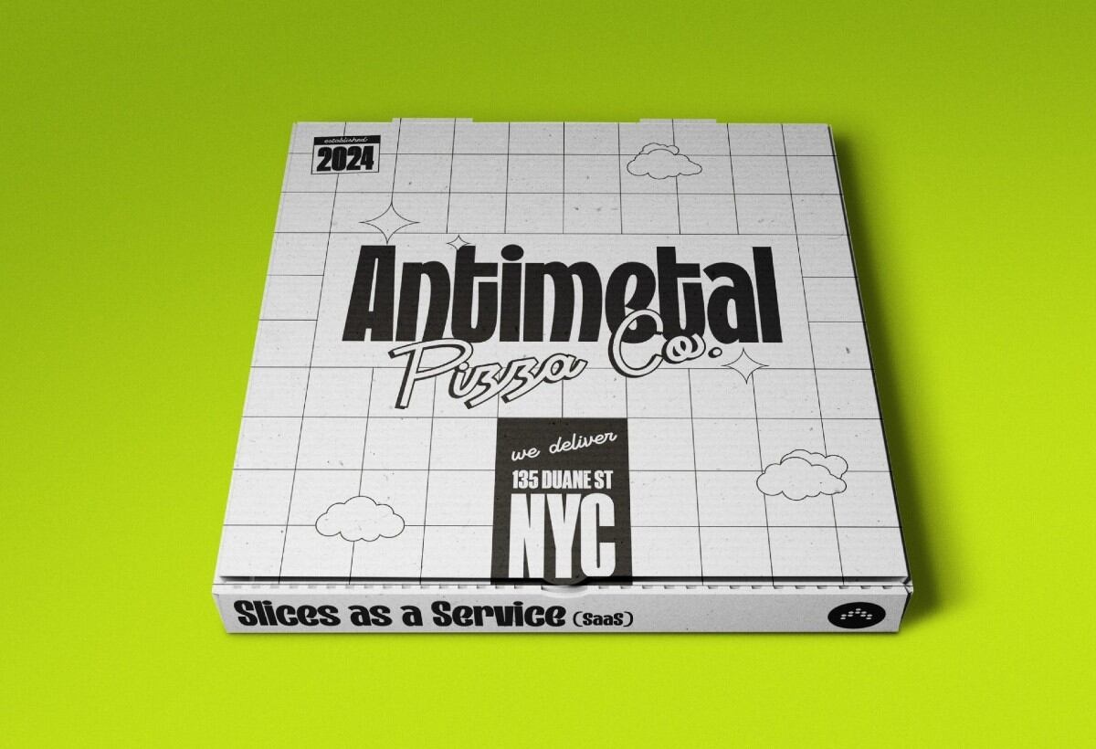 An Antimetal Pizza Co. box with the phrase Slices as a Service printed on its side.