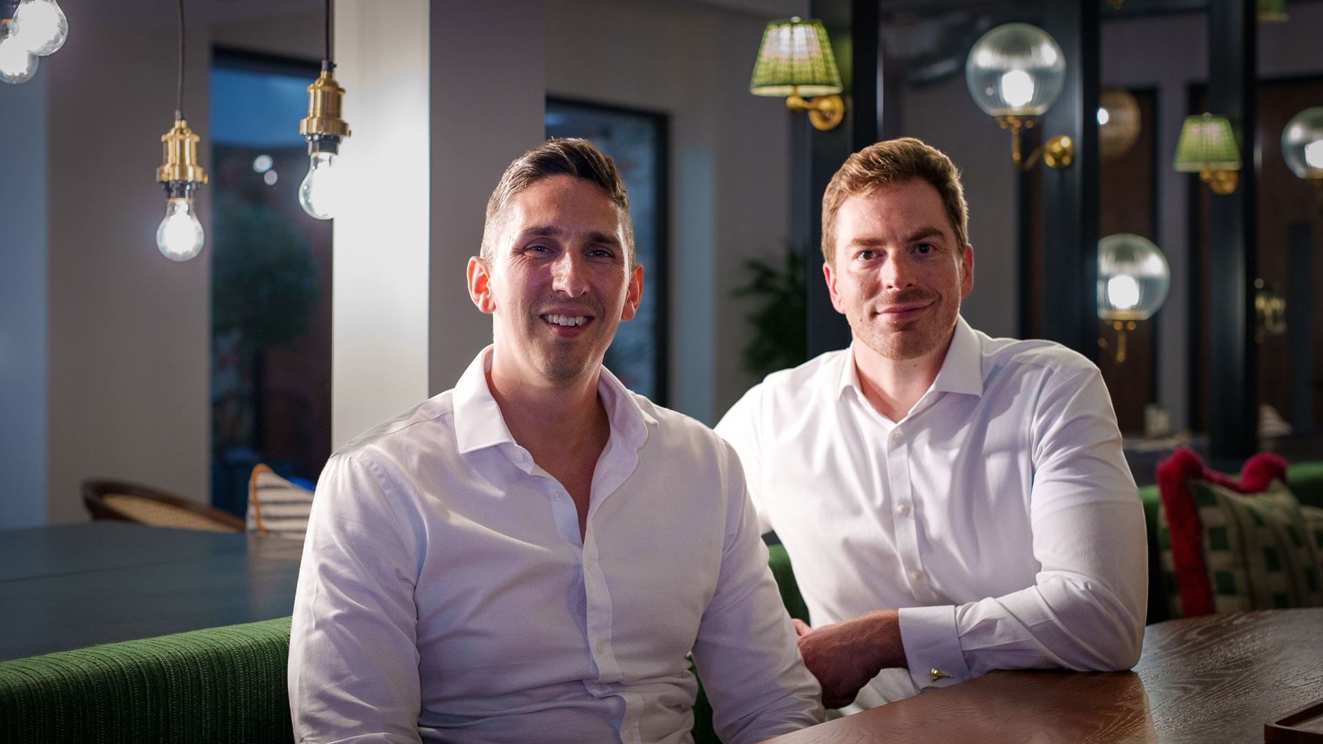 Matthew Ranson, left, and Andrew Hedley seated together in the Novatus founders’ photograph