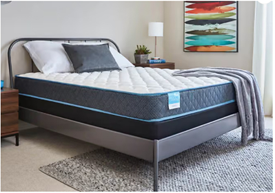 Sleepy's mattress pictured on a bed in a furnished bedroom