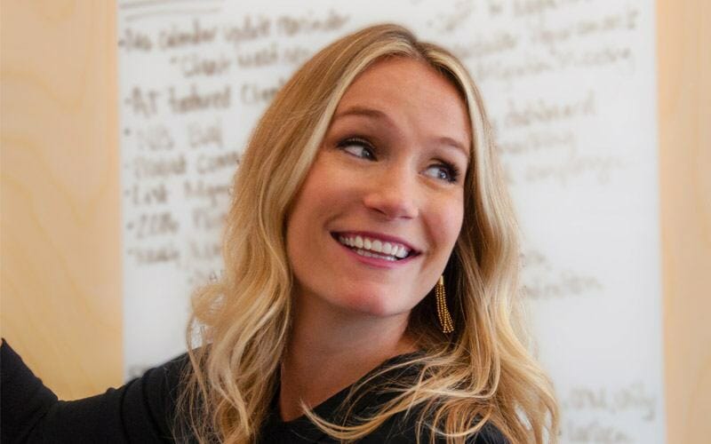 Maura Smith smiling during a conversation