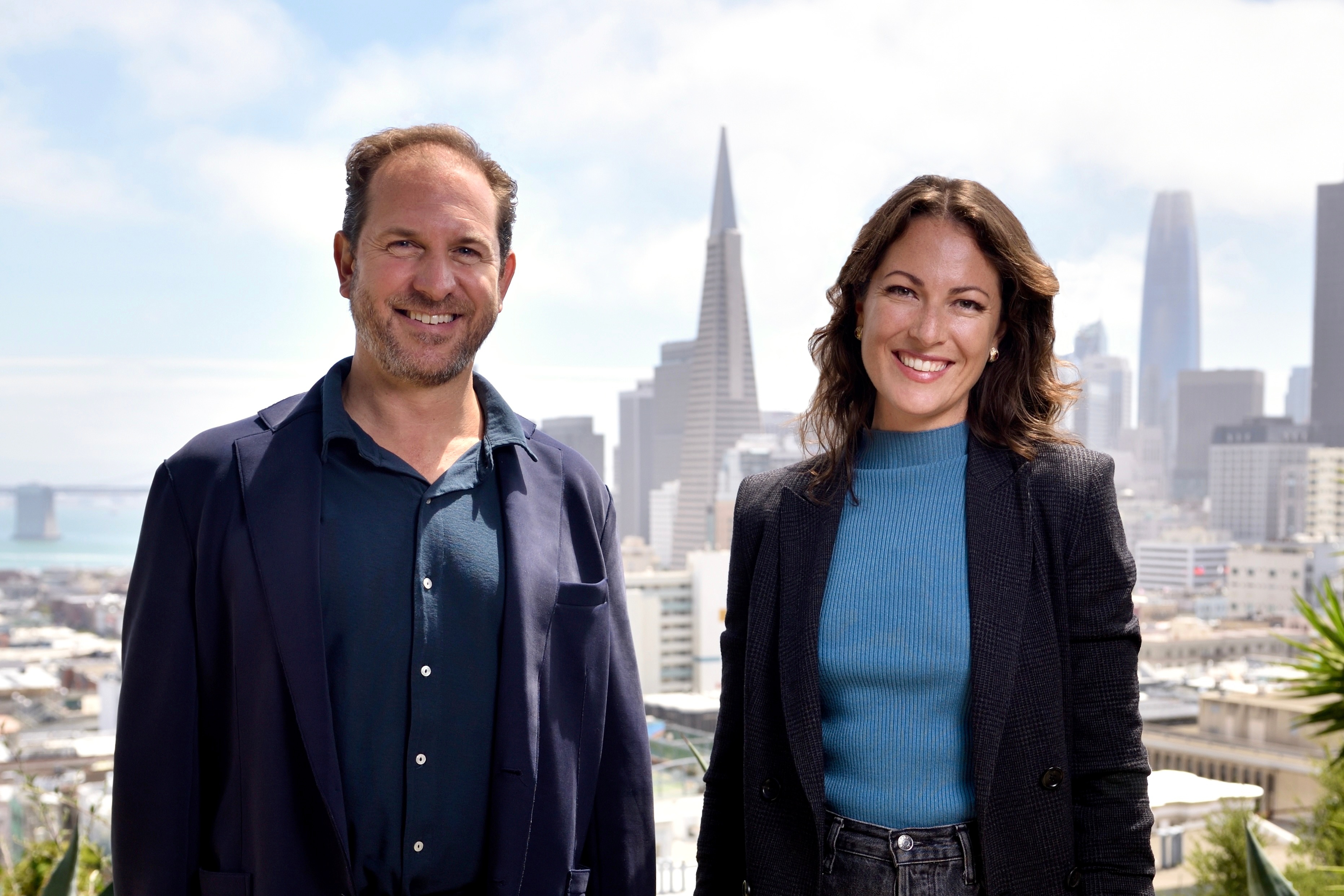 Mauricio Benavides, left, and co-founder Louise Ireland with the San Francisco skyline behind them