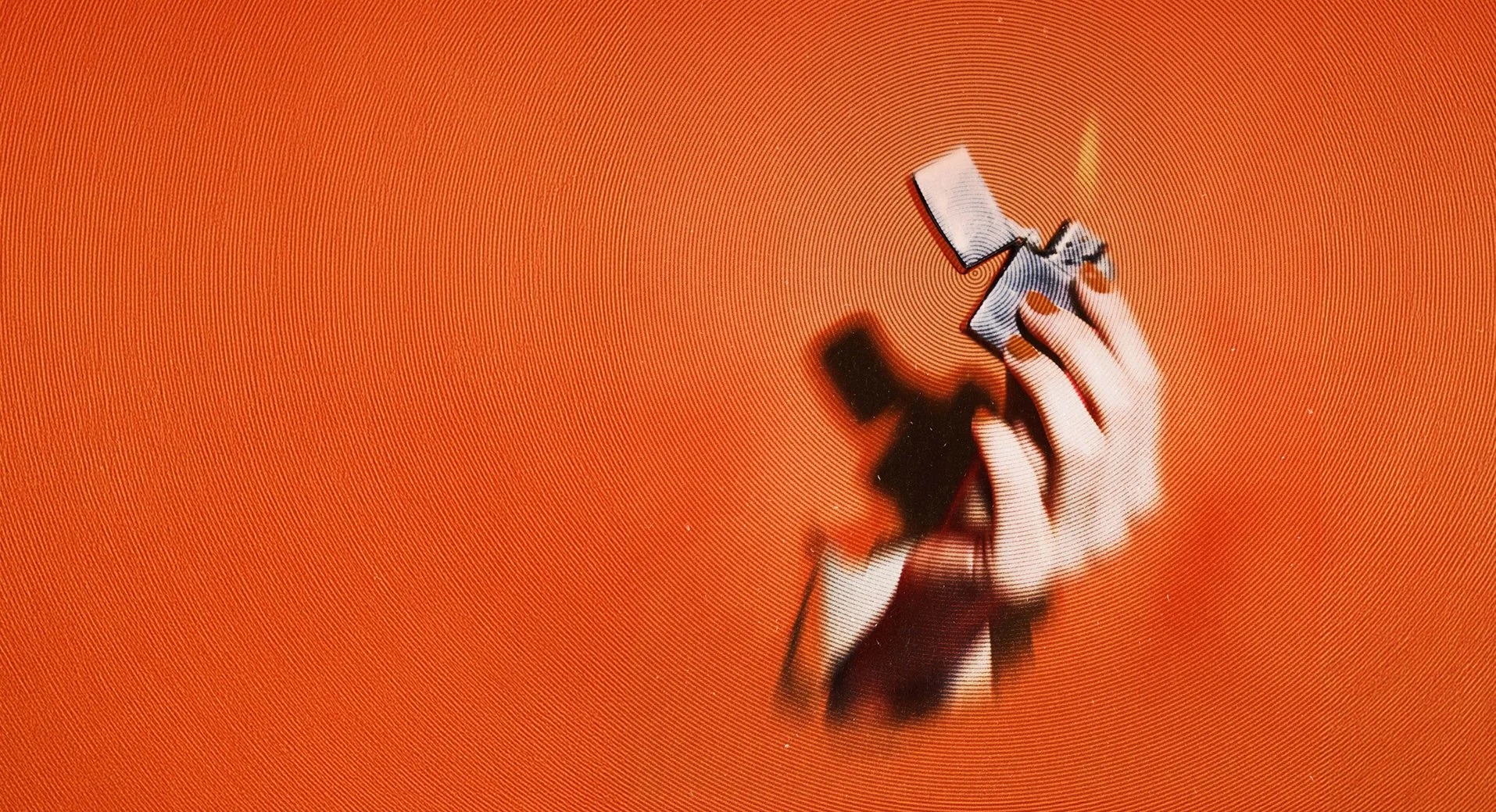 Stylized orange Maven PR brand photograph of a hand holding a megaphone