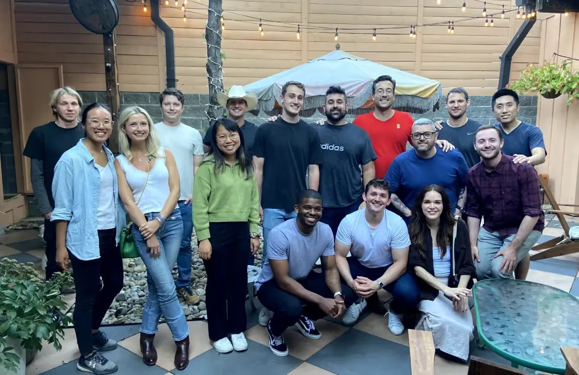 Max Greenwald, at the right in a checked shirt, with members of the Warmly team in a courtyard