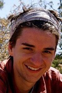 An archival photograph of Max Novendstern smiling outdoors, published in a 2012 civic technology report