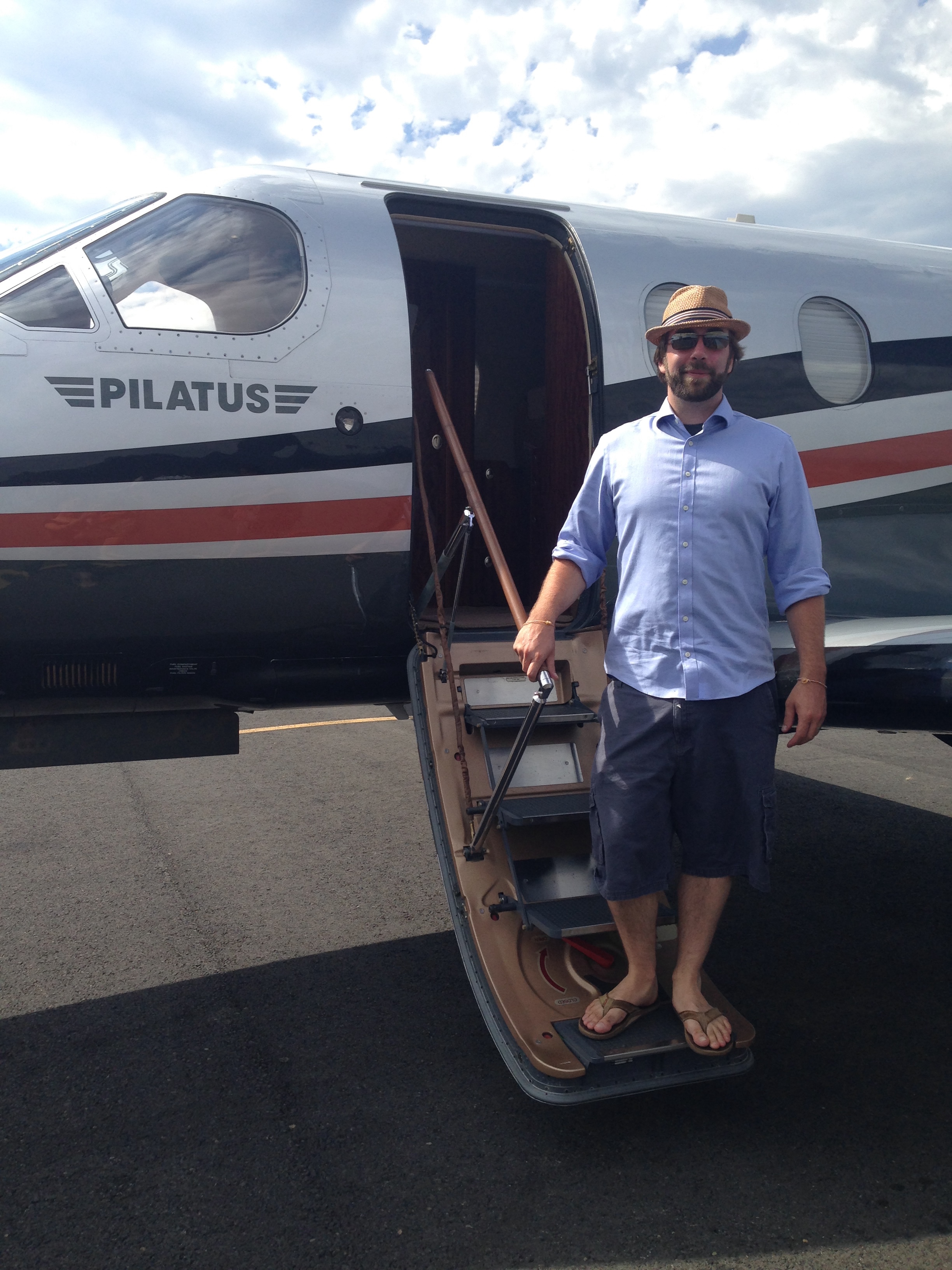 Max Porterkhamsy standing at the door of a small private plane
