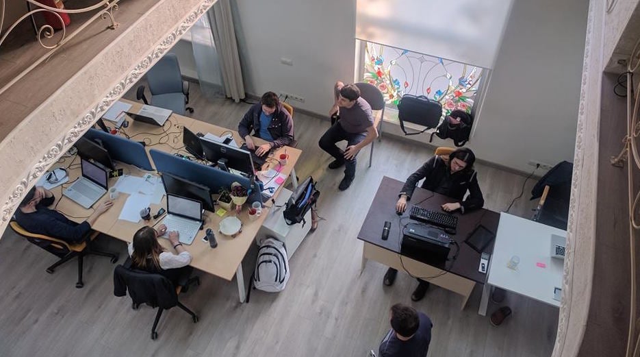 An overhead view of WorkFusion employees working at desks in an office