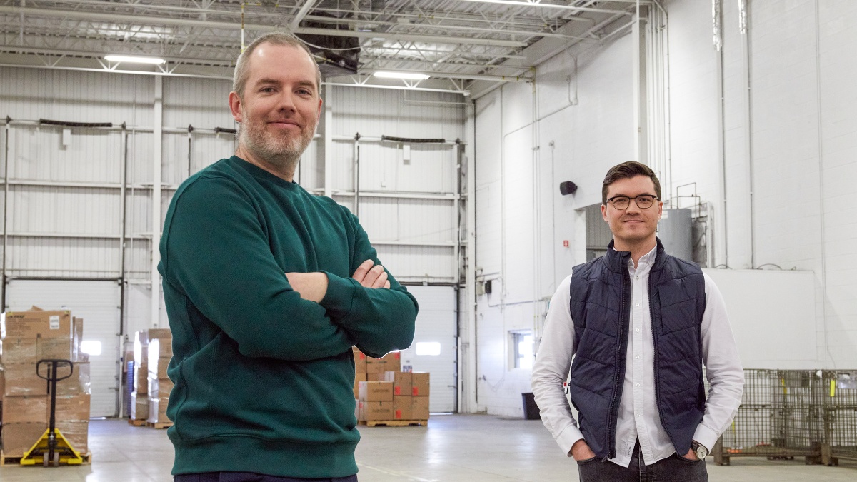 Alexandre Guimond, left, and Maxime Dubois, right, standing in an Altitude Sports warehouse