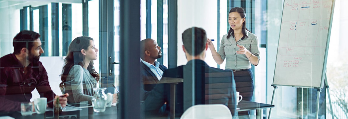 Illustrative meeting photograph published on the Maximus investor website