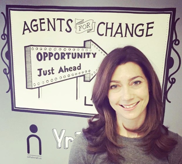 Lindsay Pattison at Maxus, beside an Agents for Change sign