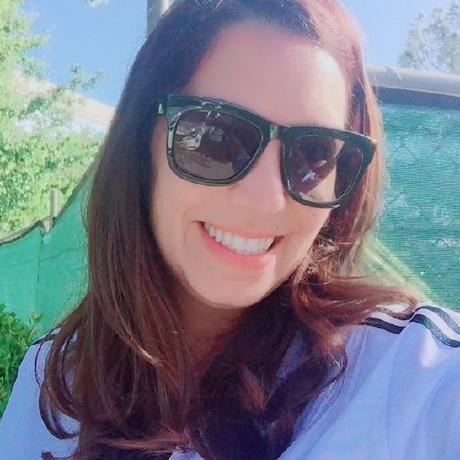 May Haim Kotlarsky smiling outdoors, wearing sunglasses, in her public GitHub profile photograph
