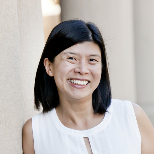 May Petry smiling in a MongoDB press portrait