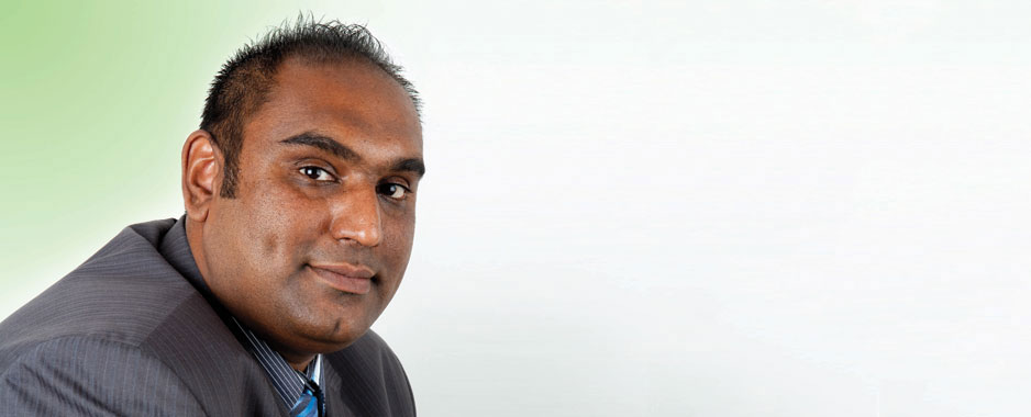 Mayan Mathen in a suit, photographed during his Dimension Data years