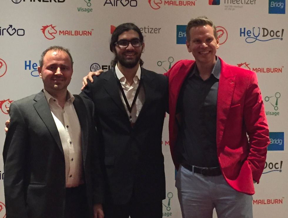 Three members of the AirGo Design team posing together at a startup event