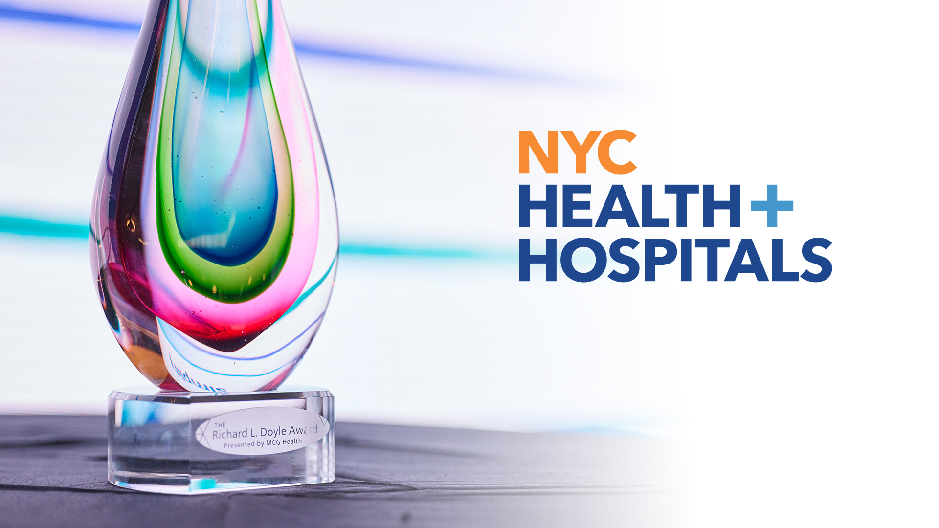 Richard L. Doyle Award trophy beside NYC Health + Hospitals branding