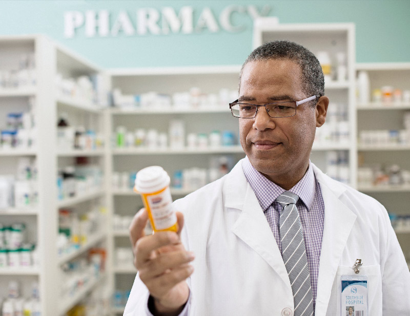 Pharmacy professionals working together behind the counter