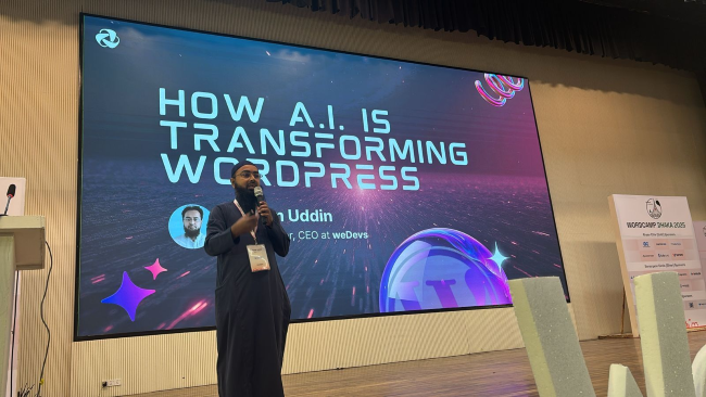 Nizam Uddin speaking beneath a screen reading How A.I. is Transforming WordPress at WordCamp Dhaka 2025