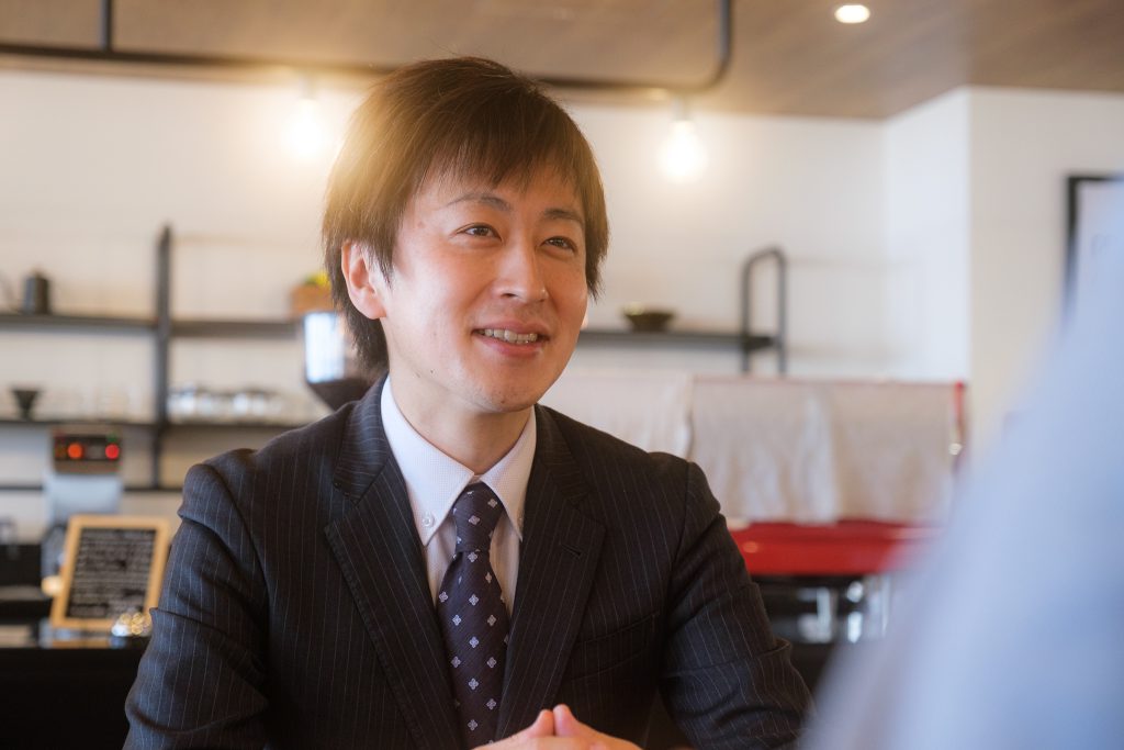 MEDICOLAB founder Kazuhiro Ikumi seated for an interview