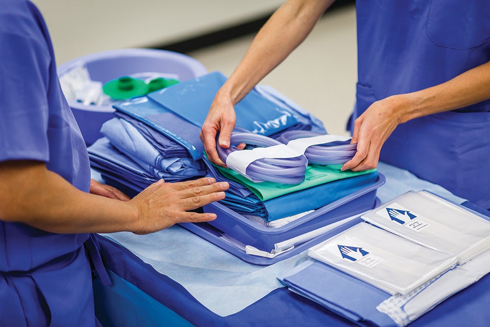 Medline employees assembling medical supply kits