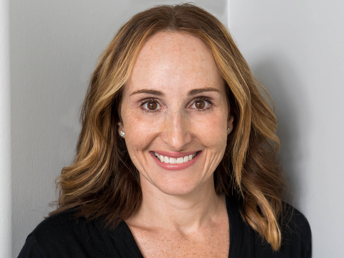 Megan Bennett smiling in an editorial portrait