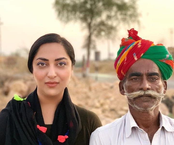 Meghan Patke beside a man wearing a colorful turban in Jaisalmer, Rajasthan, in 2018.