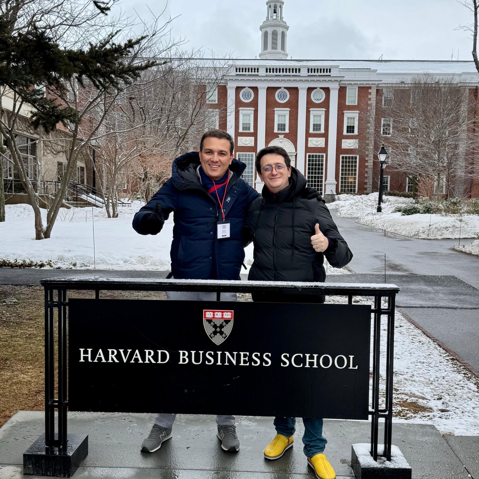 Mehdi Alaoui, on the left, and a companion outside Harvard Business School in snowy weather