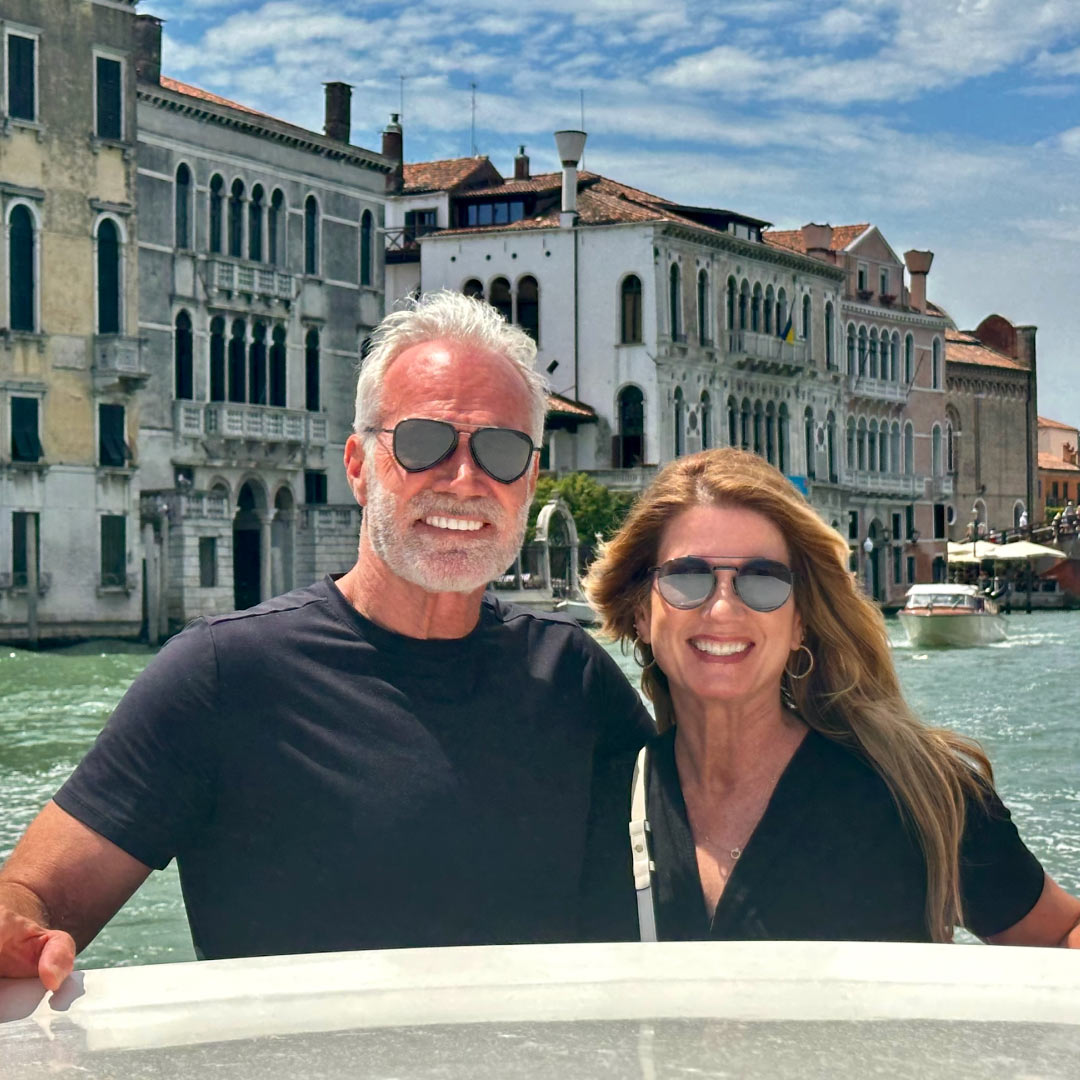 Melea McRae-Hall and her husband on a boat in Venice