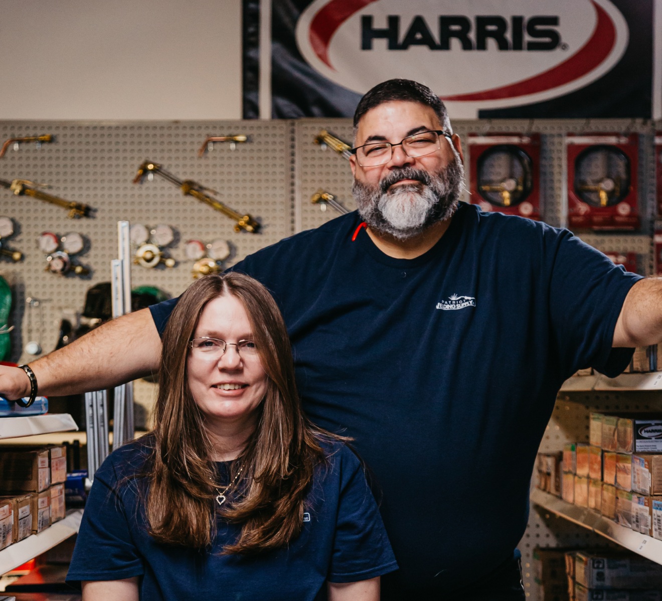Jenny and Leo Hernandez at Patriot Welding Supply, surrounded by welding equipment