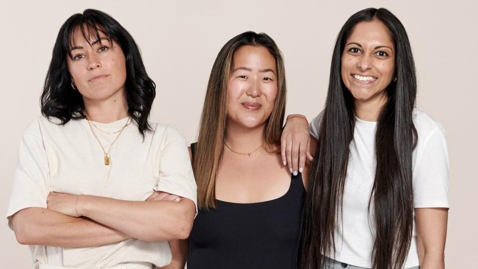 Dagne Dover co-founders Jessy Dover, Melissa Mash, and Deepa Gandhi standing together