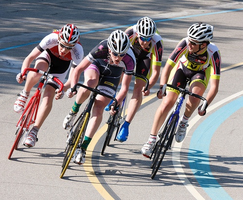 Cyclists rounding a bend at the Northeast Velodrome, in an archival photograph identified by Harvard Cycling as featuring Merrill Lutsky.